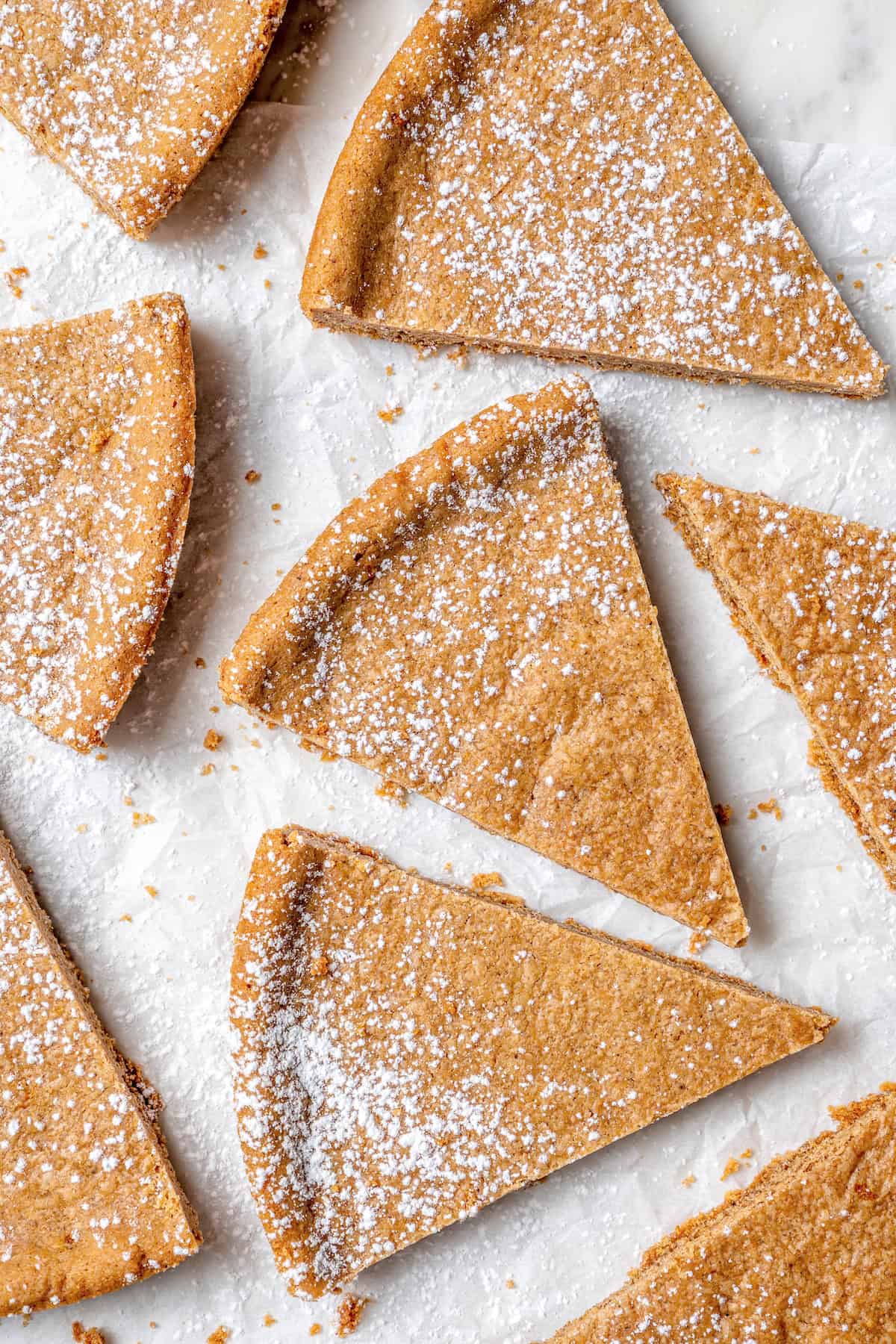 Overhead view of spice cookies dusted with powdered sugar