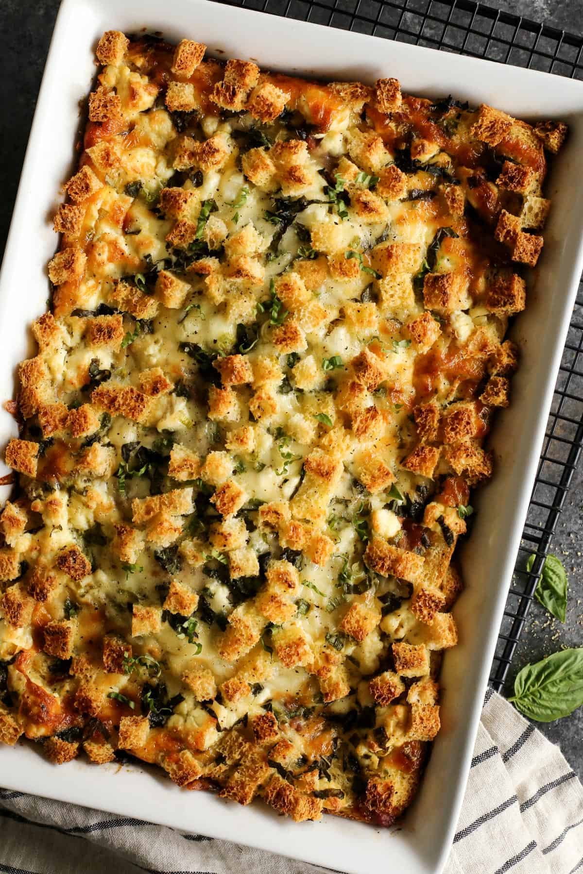 overnight egg bake in a white baking dish