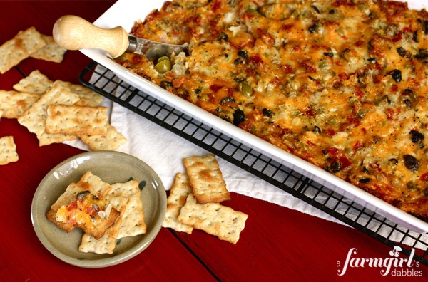 Hot Pizza Dip being served on crackers