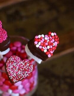 heart shaped marshmallow pops dipped in chocolate and sprinkles