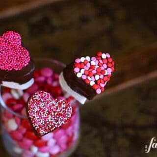 heart shaped marshmallow pops dipped in chocolate and sprinkles