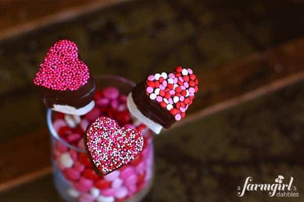 heart shaped marshmallow pops dipped in chocolate and sprinkles