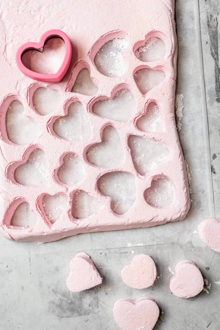 Overhead view showing marshmallow hearts being cut