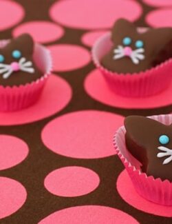 Chocolate dipped marshmallow bunnies in baking cups