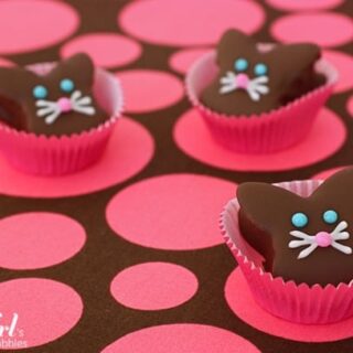 Chocolate dipped marshmallow bunnies in baking cups