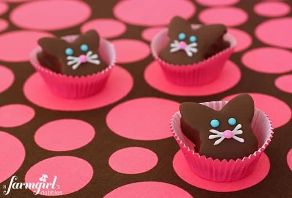 Chocolate dipped marshmallow bunnies in baking cups