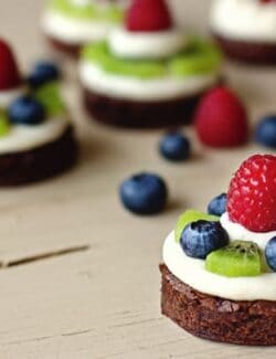 brownie circles topped with almond cream cheese and fresh fruit