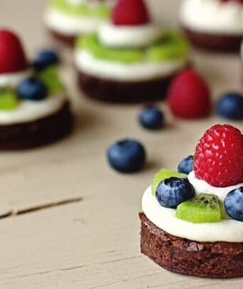 brownie circles topped with almond cream cheese and fresh fruit