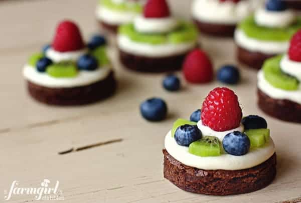 brownie circles topped with almond cream cheese and fresh fruit