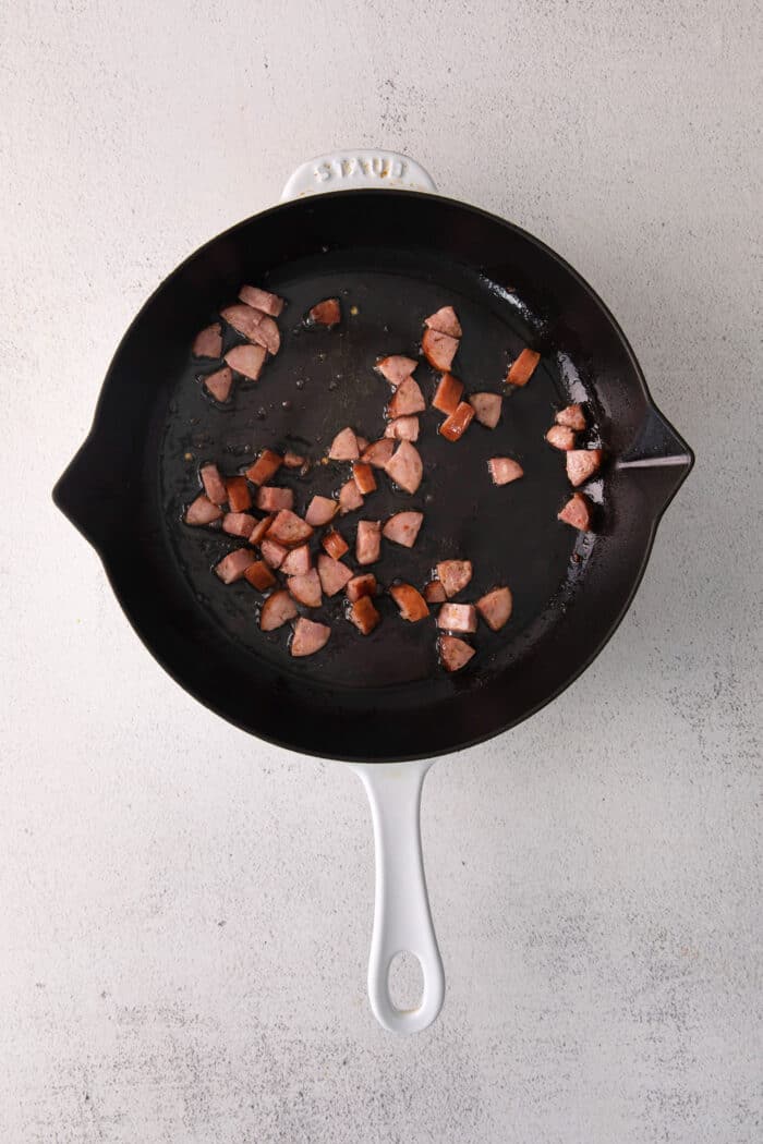 Andouille sausage in a cast iron skillet