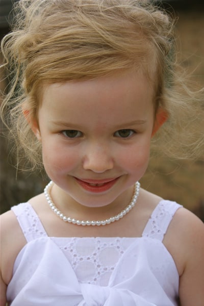 a young girl in a white dress