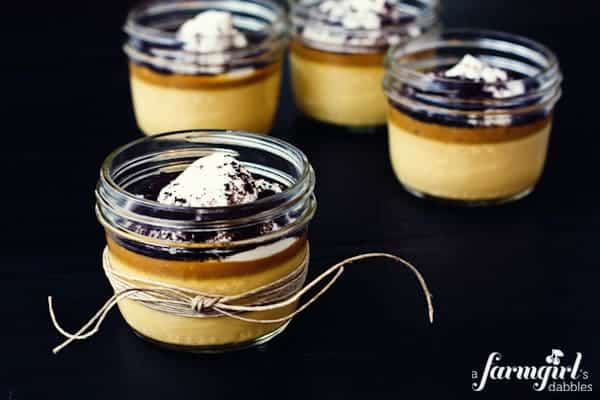 Mini jars of caramel custard with salted caramel sauce and whipped cream