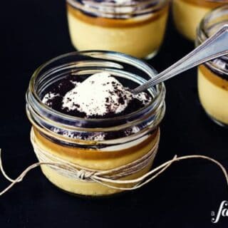 a jar of caramel custard with a spoon