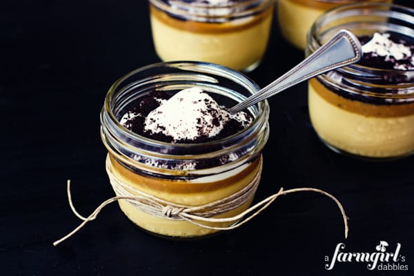 a jar of caramel custard with a spoon