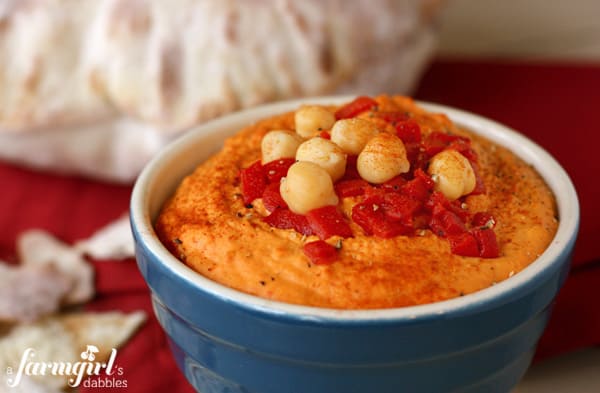 a blue bowl of hummus