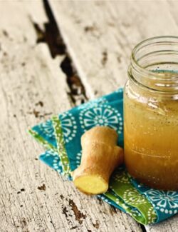 a jar of ginger dressing with fresh ginger