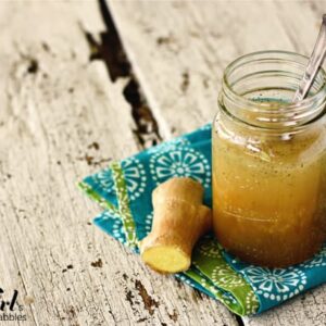 a jar of ginger dressing with fresh ginger