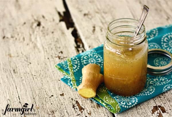 a jar of ginger dressing with fresh ginger