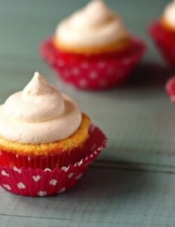 frosted cupcakes with pink wrappers