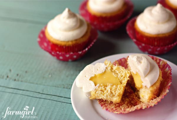 a cupcake sliced in half showing the middle filling