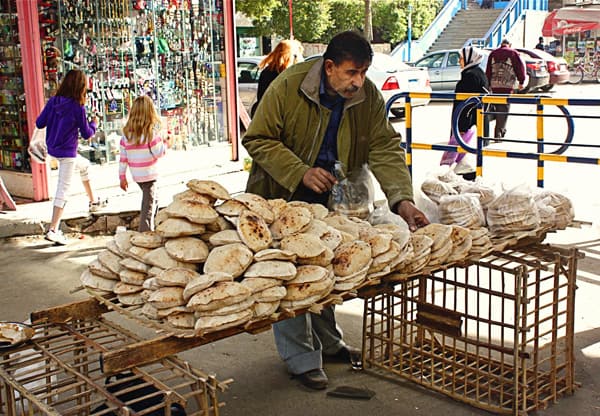 a man selling pita bread in Egypt