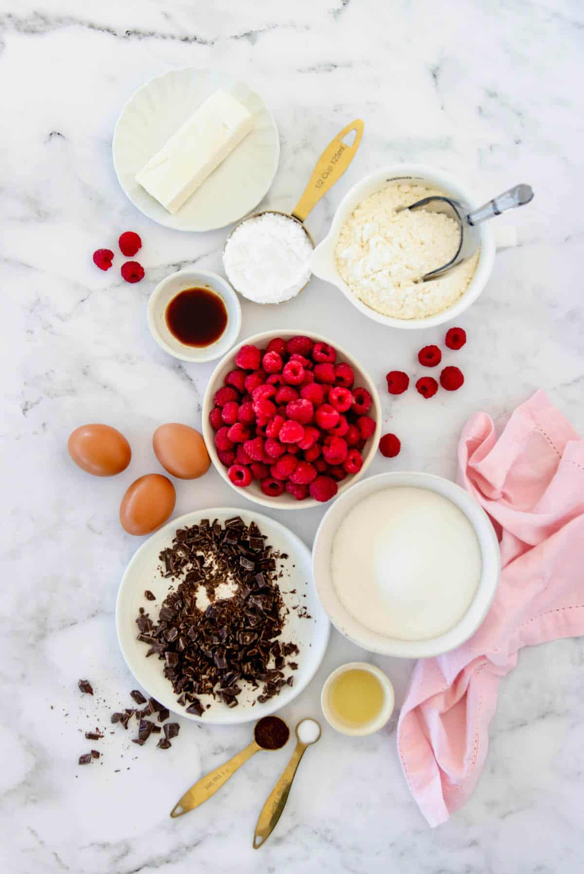 Overhead view of all ingredients for brownie bites with raspberry buttercream