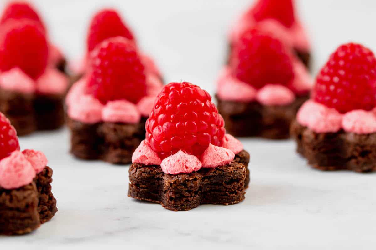 Brownies shaped like flowers, topped with raspberry