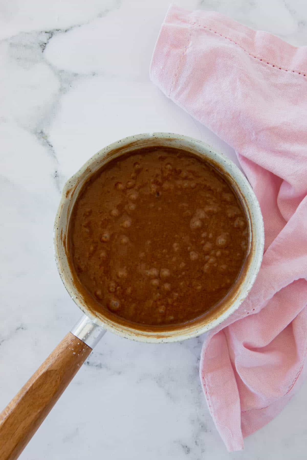 Brownie batter in a saucepan