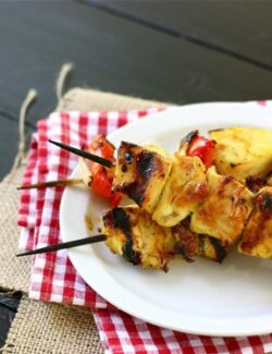 a white plate of Grilled Chicken Kebabs