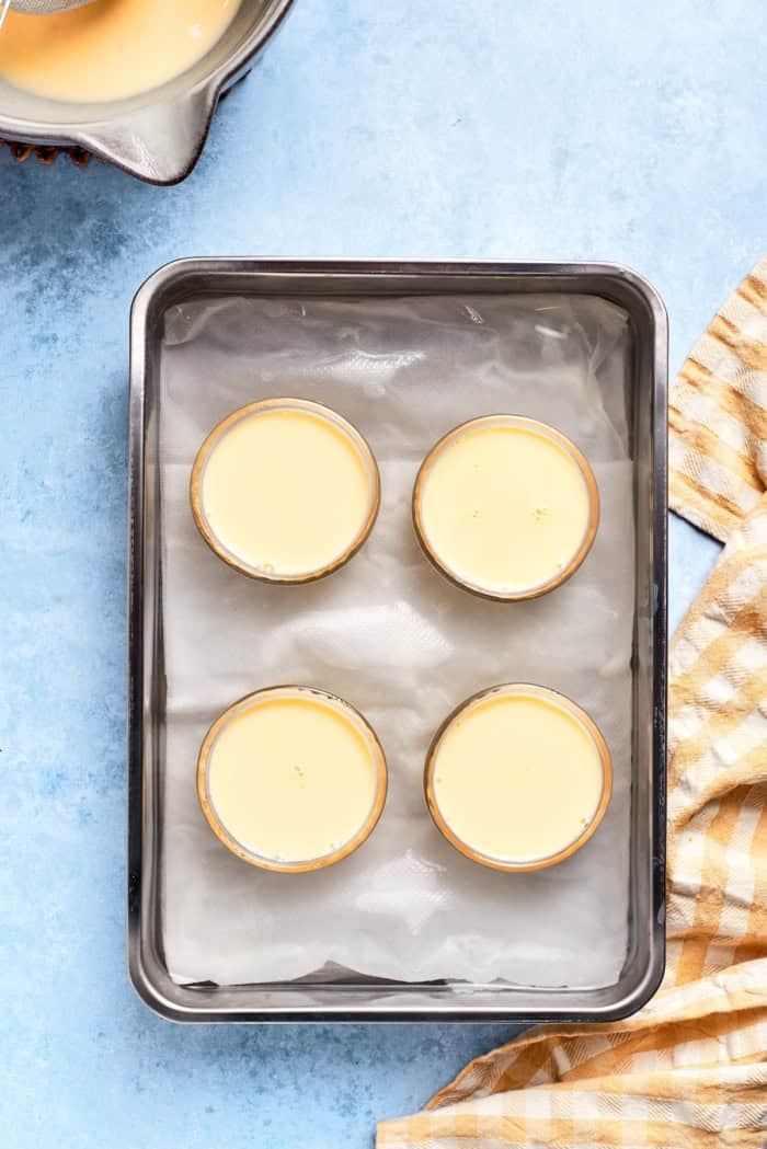 Overhead view of unbaked lemon custard cups