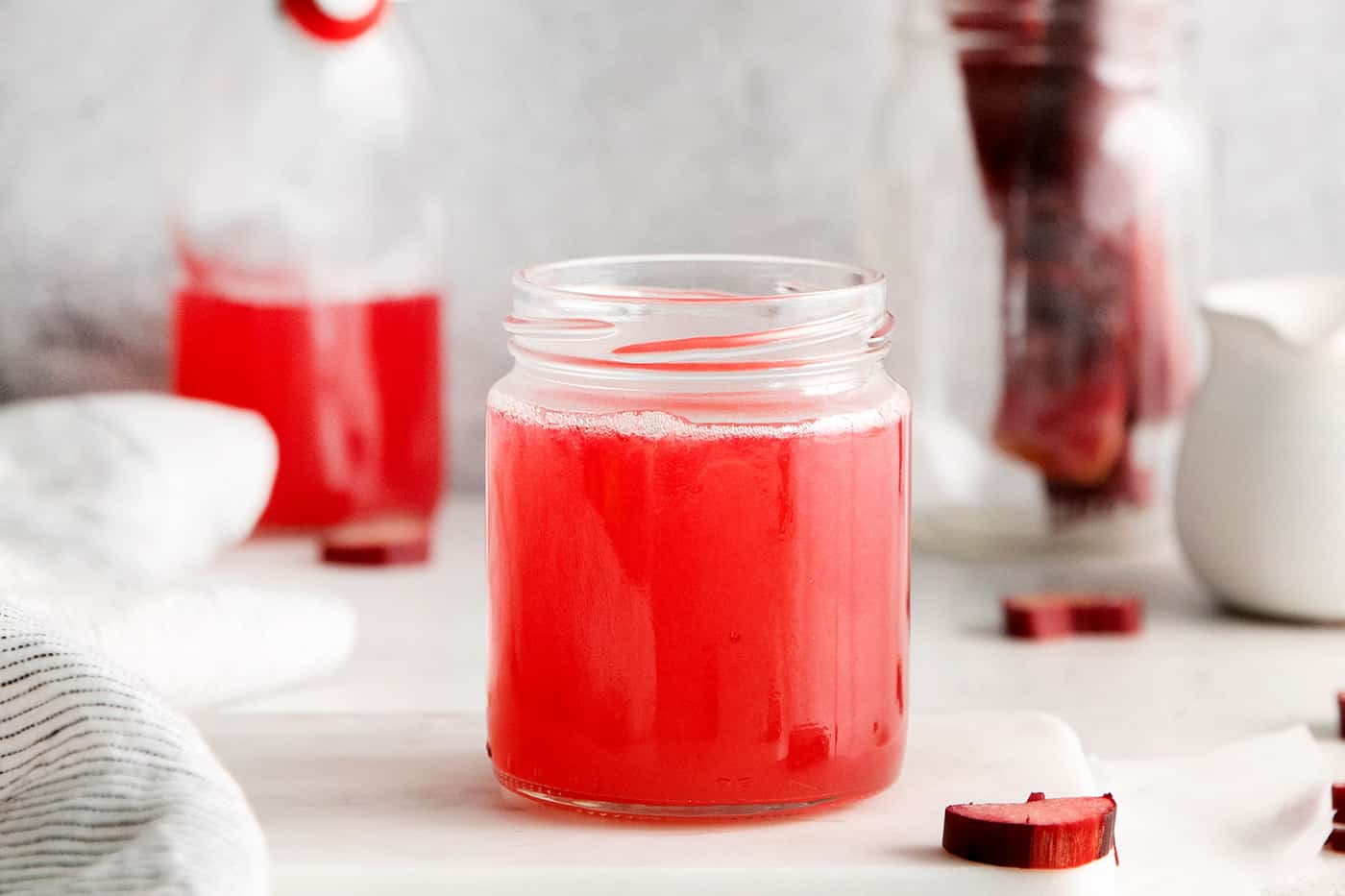 A small jar of rhubarb simple syrup