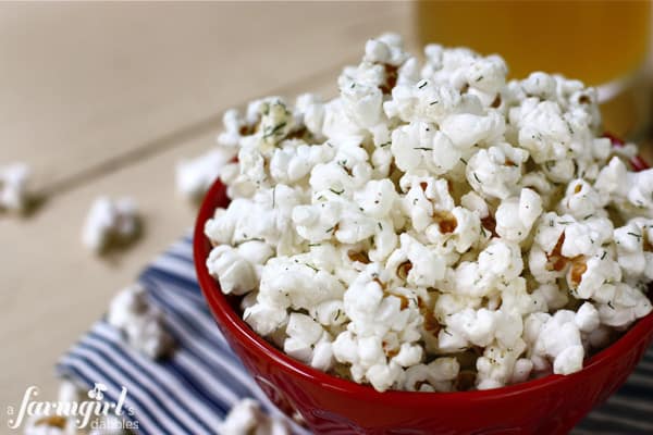 a red bowl of seasoned Popcorn