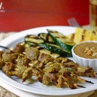 beef skewers and grilled vegetables with peanut dipping sauce