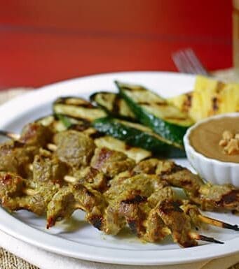 beef skewers and grilled vegetables with peanut dipping sauce