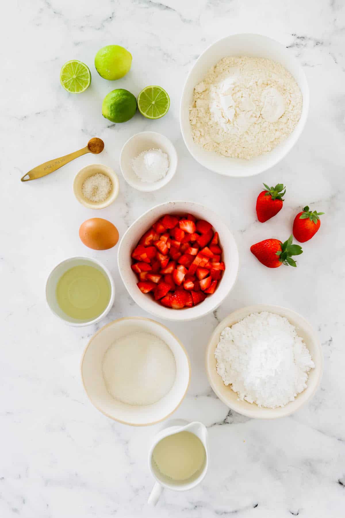 Overhead view of homemade strawberry muffin ingredients