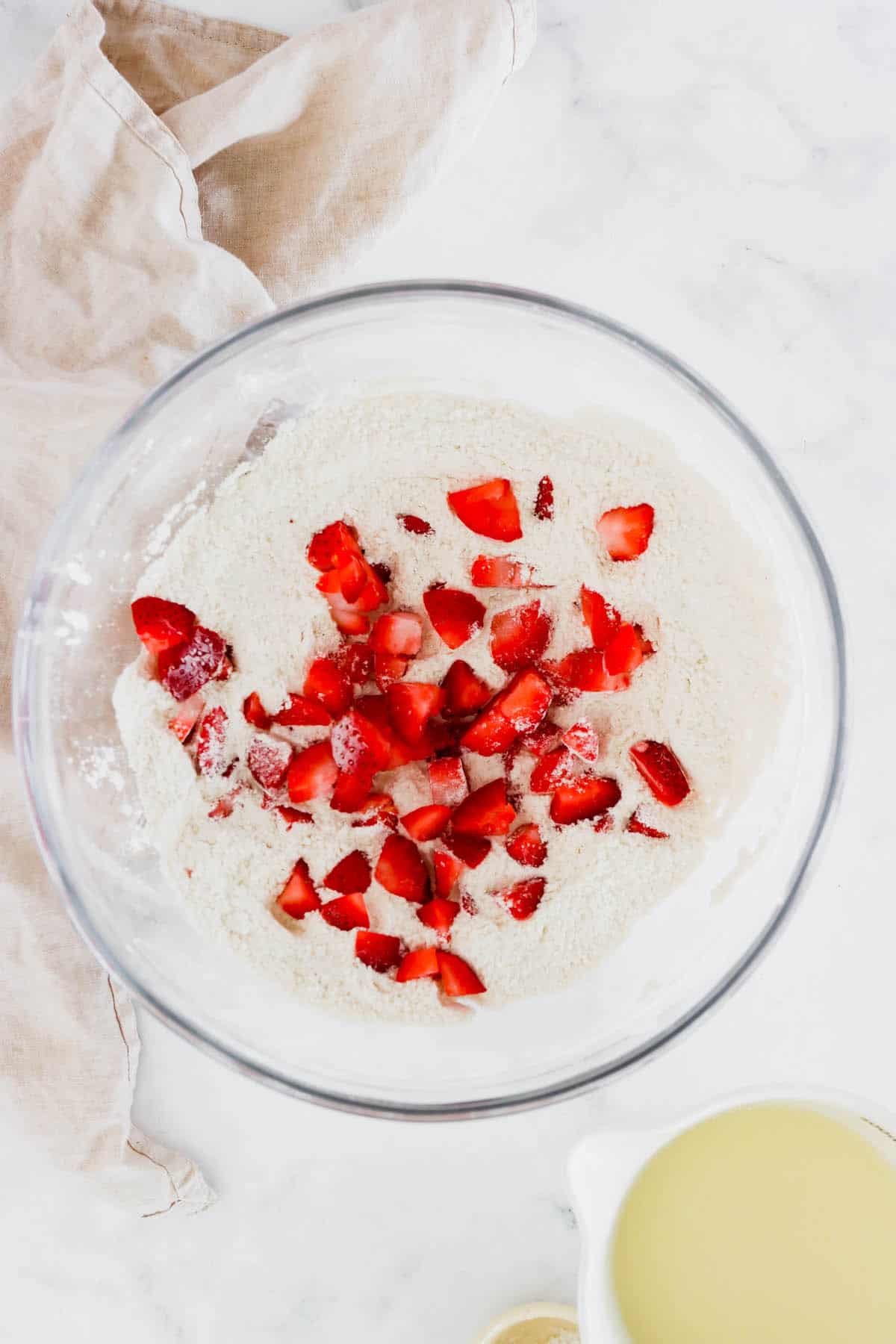 Strawberry muffin batter in a mixing bowl