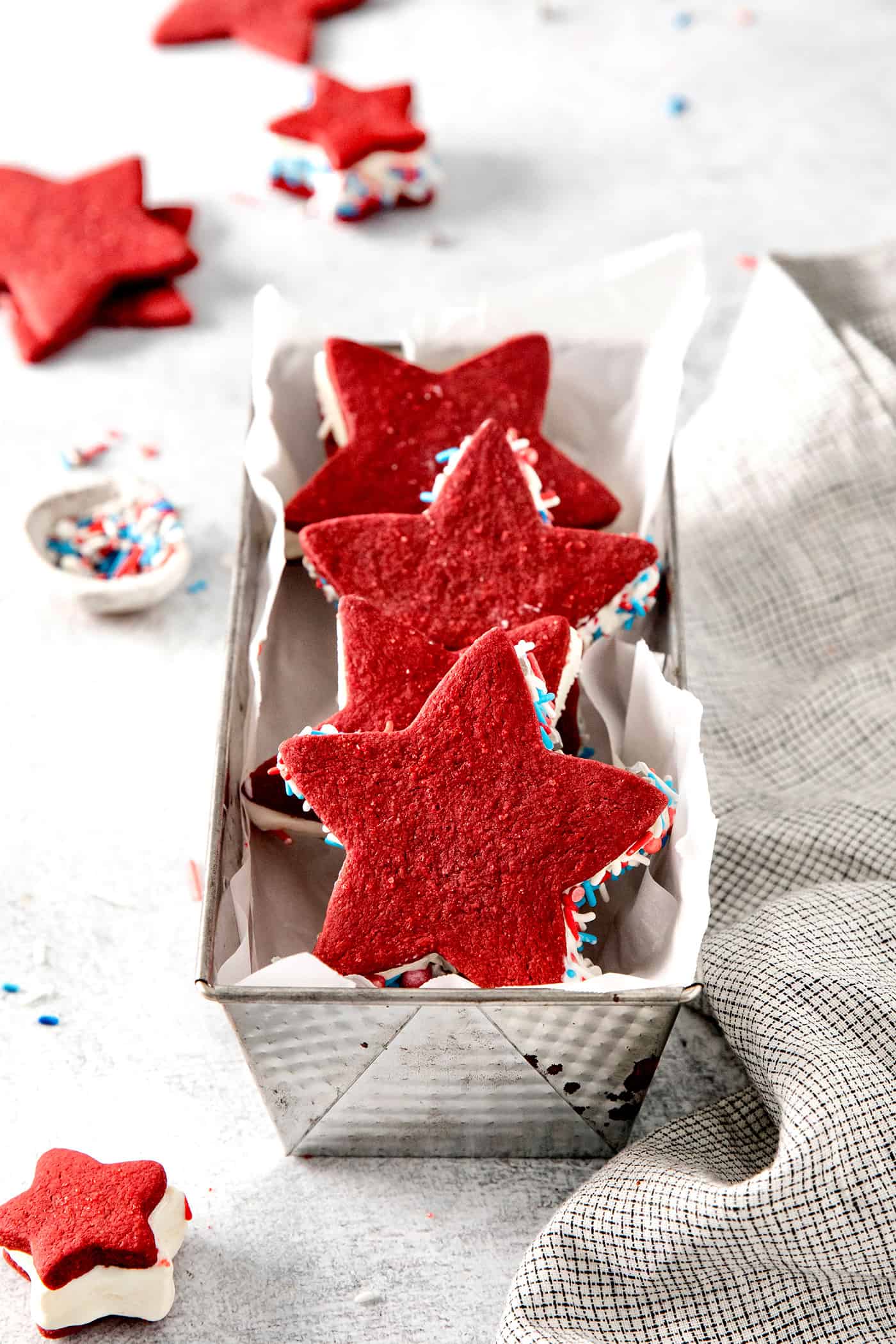 Three star shaped ice cream sandwiches in a pan