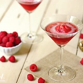 a martini glass with raspberries sorbet