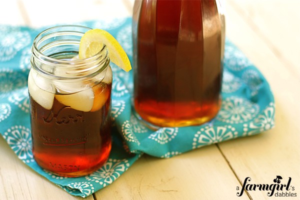 a pitcher and glass of iced tea