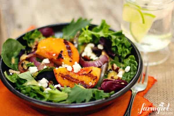 a salad with grilled peaches and onions