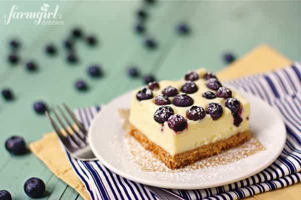 These cheesecake bars are so creamy and made with fresh blueberries and white chocolate.