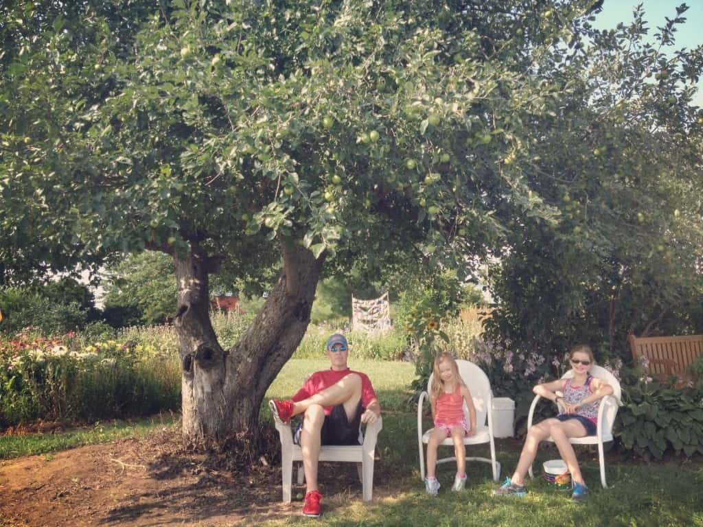 three people sitting on white chairs