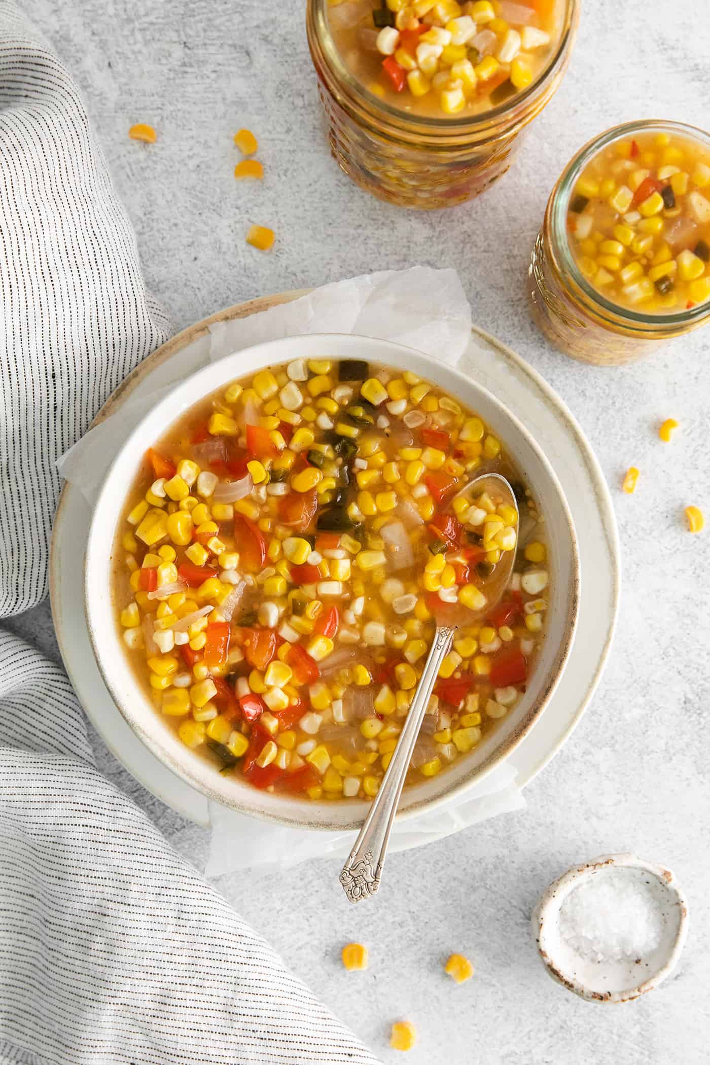 Sweet corn relish being spooned into jars