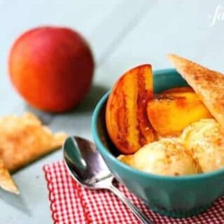 a bowl with grilled peaches, ice cream, and cinnamon pie crust