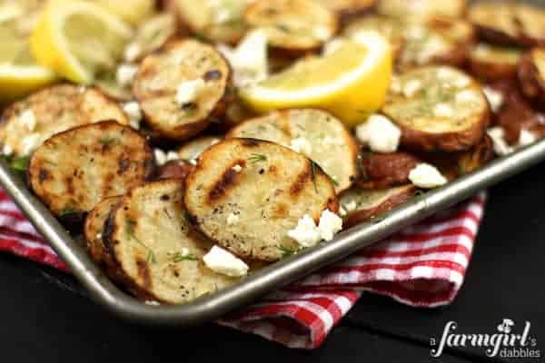 a pan of roasted potatoes with feta and dill