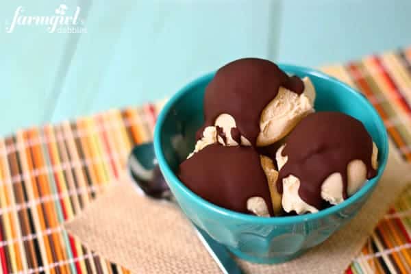 scoops of peanut butter ice cream topped with chocolate magic shell