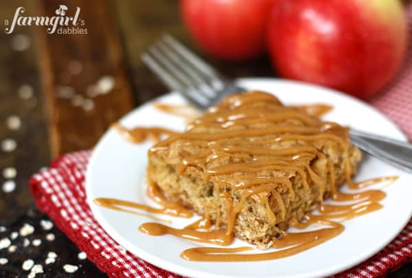 An Apple Oatmeal Bar on a Dish with Caramel Sauce Drizzled on Top