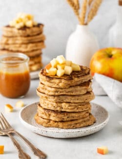 Angled view of a stack of apple oatmeal pancakces