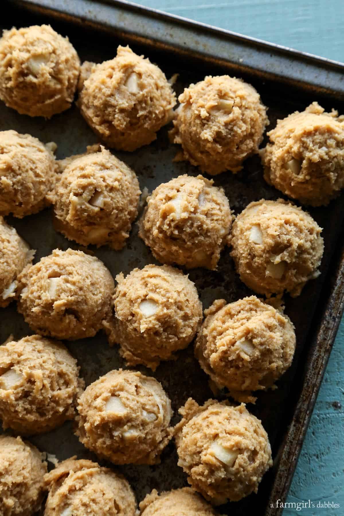 Apple Peanut Butter Cookies dough balls on a baking pan