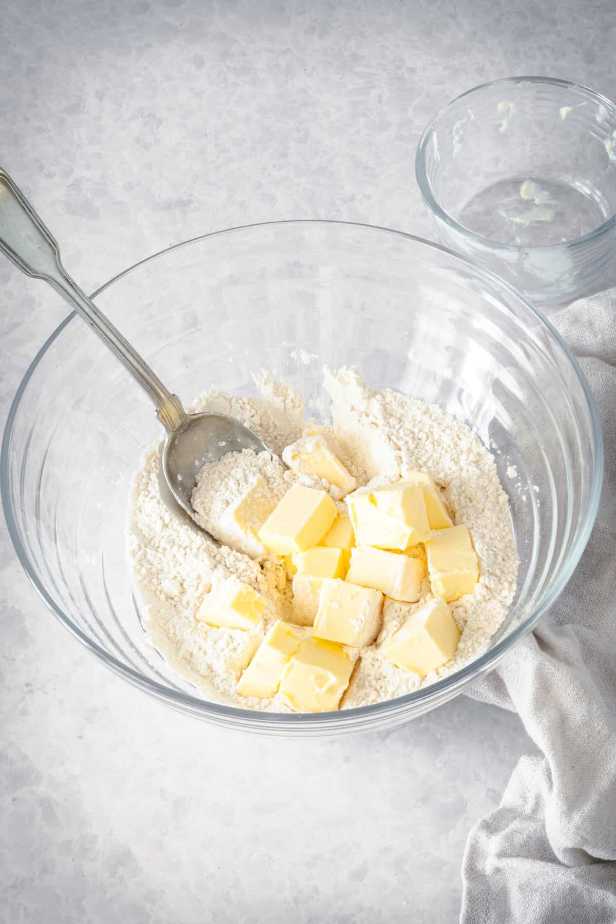 Butter being cut into pastry dough